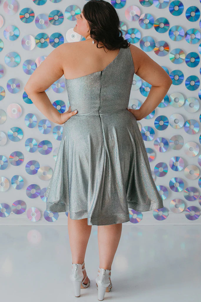 Sydney's Closet SC8119 A-Line One Shoulder Strap Satin Holographic Fabric With Pockets Short Plus Size Homecoming Dress. It's time to shine like a diamond in Sydney's Closet SC8119 A-Line One Shoulder Strap Satin Holographic Fabric With Pockets Short Plus Size Homecoming Dress! Boasting a luxe satin fabric, holographic detailing, and one shoulder strap, you'll be making a statement like never before! Plus, the pockets add a touch of practicality to your flashy evening look!