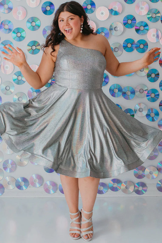 Sydney's Closet SC8119 A-Line One Shoulder Strap Satin Holographic Fabric With Pockets Short Plus Size Homecoming Dress. It's time to shine like a diamond in Sydney's Closet SC8119 A-Line One Shoulder Strap Satin Holographic Fabric With Pockets Short Plus Size Homecoming Dress! Boasting a luxe satin fabric, holographic detailing, and one shoulder strap, you'll be making a statement like never before! Plus, the pockets add a touch of practicality to your flashy evening look!