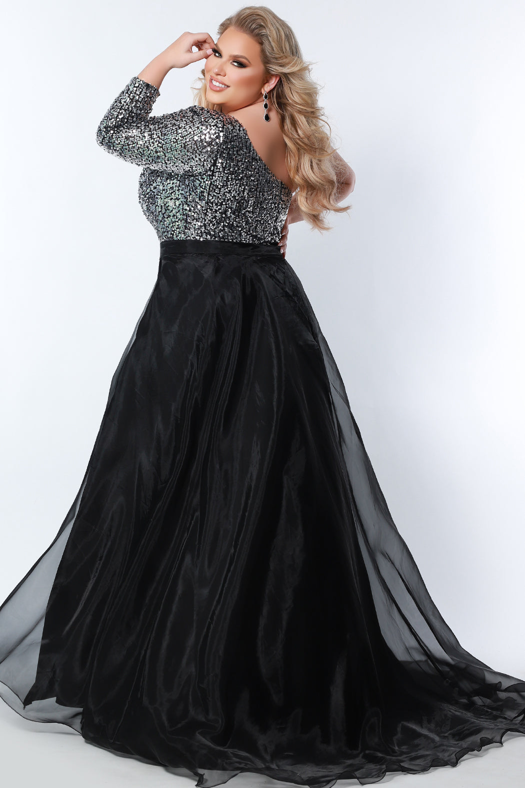 Sydney's Closet SC9107 Long Sequin Plus Size Jumpsuit One Shoulder Long Sleeve Formal  Color: Platinum Size: 14-28 Jumpsuit Sequins on mesh One-shoulder long sleeve Natural waistline Pockets Wide leg pant Fully lined ***Overskirt NOT INCLUDED!!! - Style SC9109
