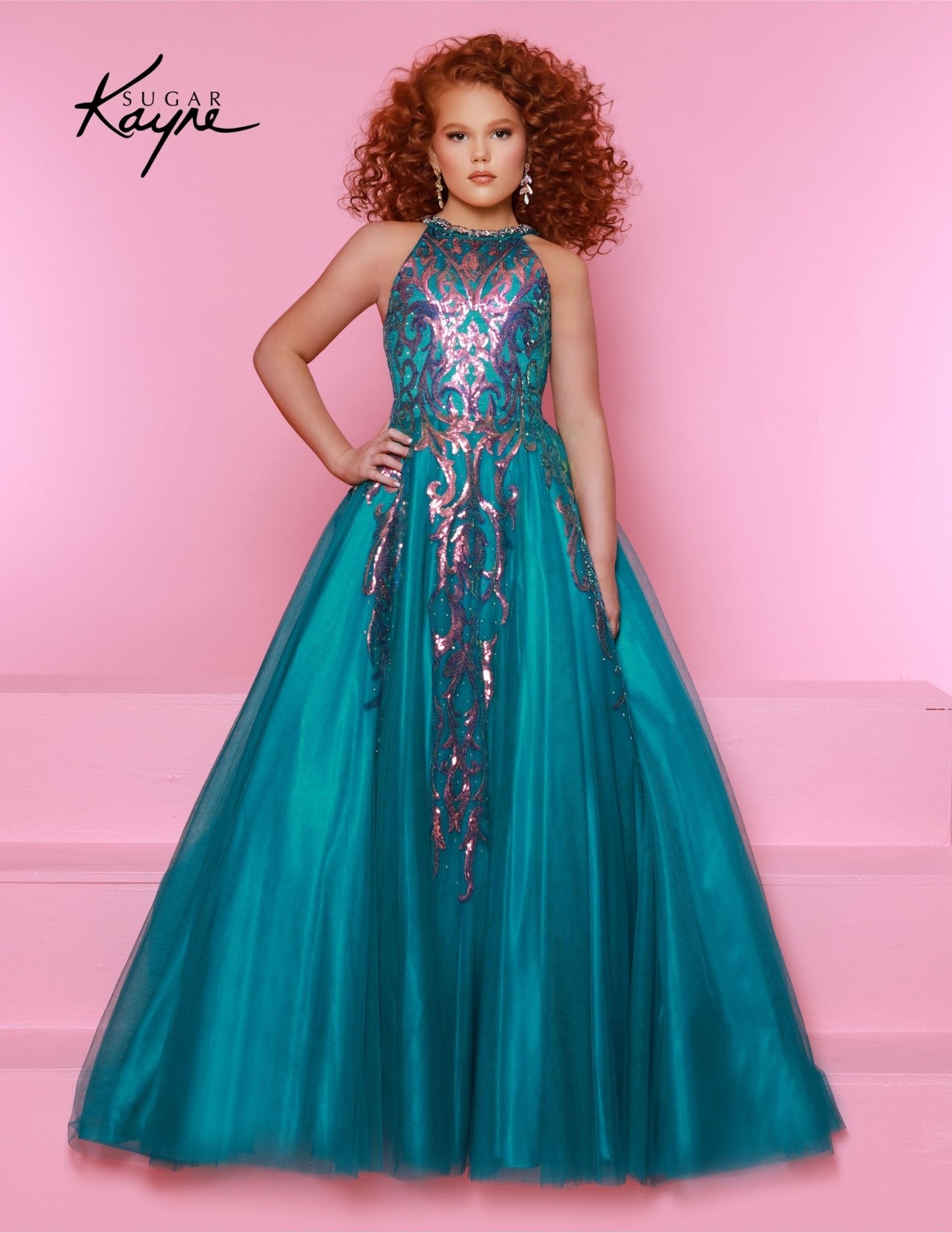 This Sugar Kayne C344 Preteen Pageant Dress is the perfect choice for any special occasion. The dress features a halter neckline, a glittering sequin bodice, and an A-line skirt. Its classic design and streamlined silhouette bring a timeless elegance to any event.&nbsp;Glittering Grace! This Sequin Mesh Ballgown and halter-style neckline ensure you will captivate the audience with grace and style!

Color:&nbsp;Jade, Magenta, Sky Blue

Size:&nbsp;2, 4, 6, 8, 10, 12, 14, 16

Fabric:&nbsp;Mesh, Sequin Mesh, Sa