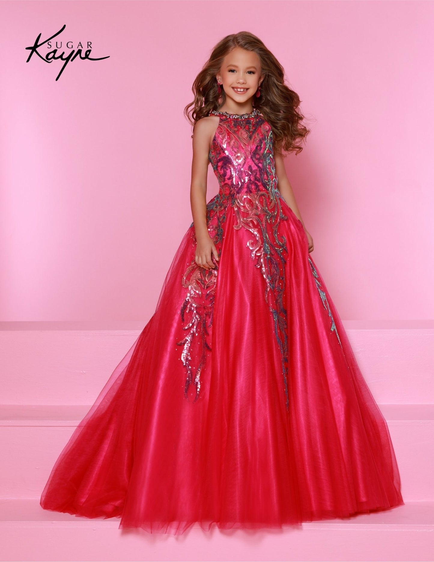 This Sugar Kayne C344 Preteen Pageant Dress is the perfect choice for any special occasion. The dress features a halter neckline, a glittering sequin bodice, and an A-line skirt. Its classic design and streamlined silhouette bring a timeless elegance to any event.&nbsp;Glittering Grace! This Sequin Mesh Ballgown and halter-style neckline ensure you will captivate the audience with grace and style!

Color:&nbsp;Jade, Magenta, Sky Blue

Size:&nbsp;2, 4, 6, 8, 10, 12, 14, 16

Fabric:&nbsp;Mesh, Sequin Mesh, Sa