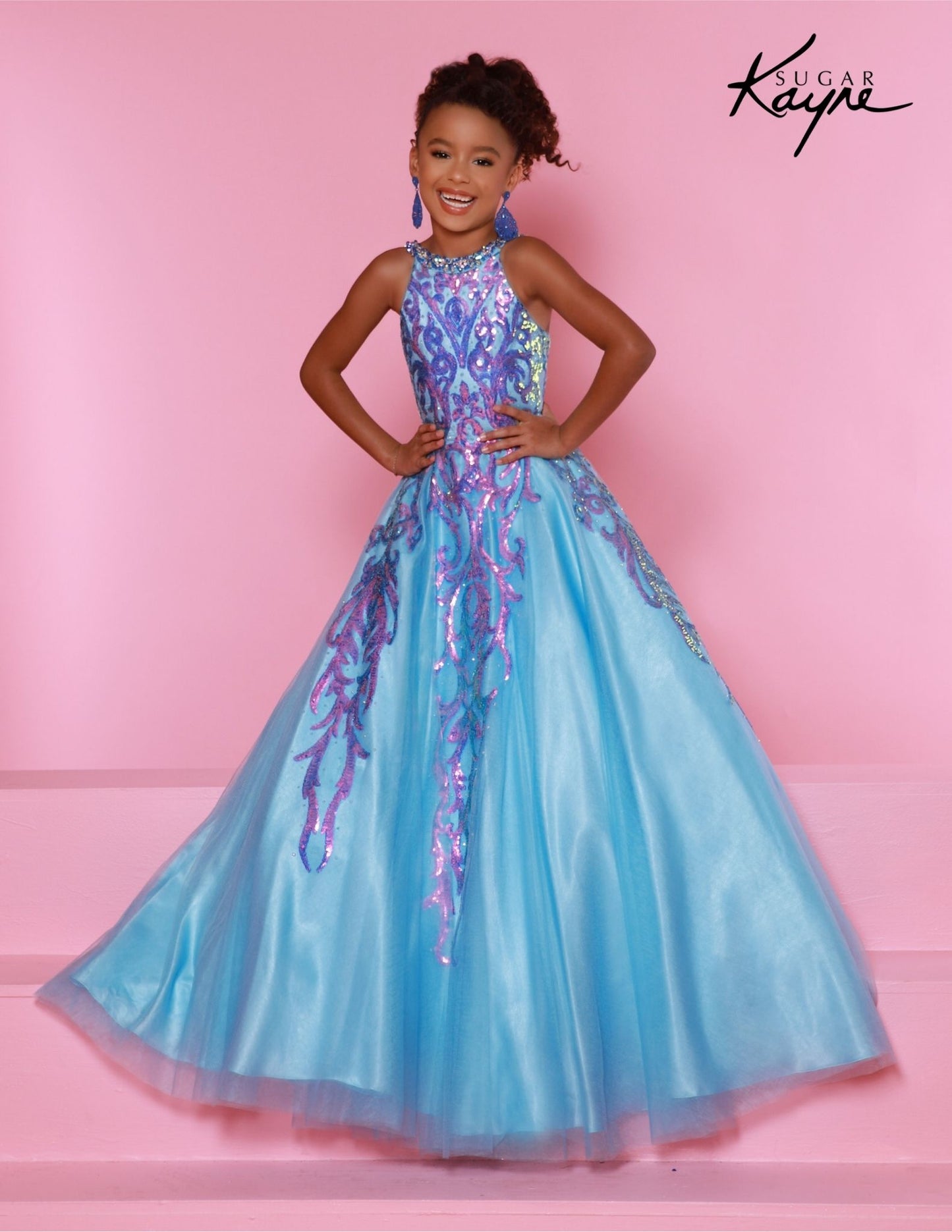 This Sugar Kayne C344 Preteen Pageant Dress is the perfect choice for any special occasion. The dress features a halter neckline, a glittering sequin bodice, and an A-line skirt. Its classic design and streamlined silhouette bring a timeless elegance to any event. Glittering Grace! This Sequin Mesh Ballgown and halter-style neckline ensure you will captivate the audience with grace and style!