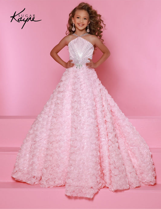 This Sugar Kayne C351 dress will make any girl feel like a princess. It features a delicate 3D rose mesh ballgown with a halter neckline and an A-line silhouette, perfect for preteen pageants. The fine detailing and quality materials ensure that this dress will turn heads and make your girl feel special. Petals of perfection – our 3D Rose Mesh Ballgown featuring a halter neckline is designed to make you shine on stage with elegance and grace!