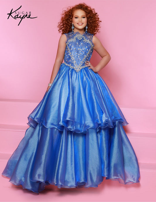 The Sugar Kayne C352 Girls Pageant Dress is a stunning choice for your little one. Crafted with a beaded bodice and layered metallic organza, this dress is sure to make your preteen dazzle on stage. A timeless choice for her big moment. Embrace the fairytale elegance in this ballgown — the beaded bodice and enchanting layers of Metallic Organza on the overskirt add a touch of fairytale magic.