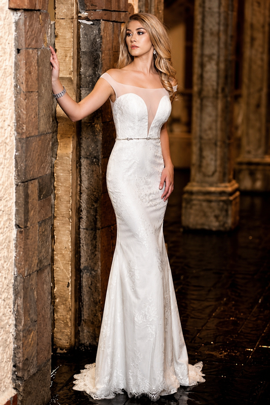 Adagio Bridal W 9317 This romantic wedding dress has sheer off the shoulder straps with plunging neckline.&nbsp; It is a fitted lace style with a thin crystal belt and the back is sheer with bridal buttons.&nbsp; Scallop eyelash lace hem. Fit &amp; Flare silhouette Great destination Bridal Gown!

Available Size: 4

Available Color: Ivory


