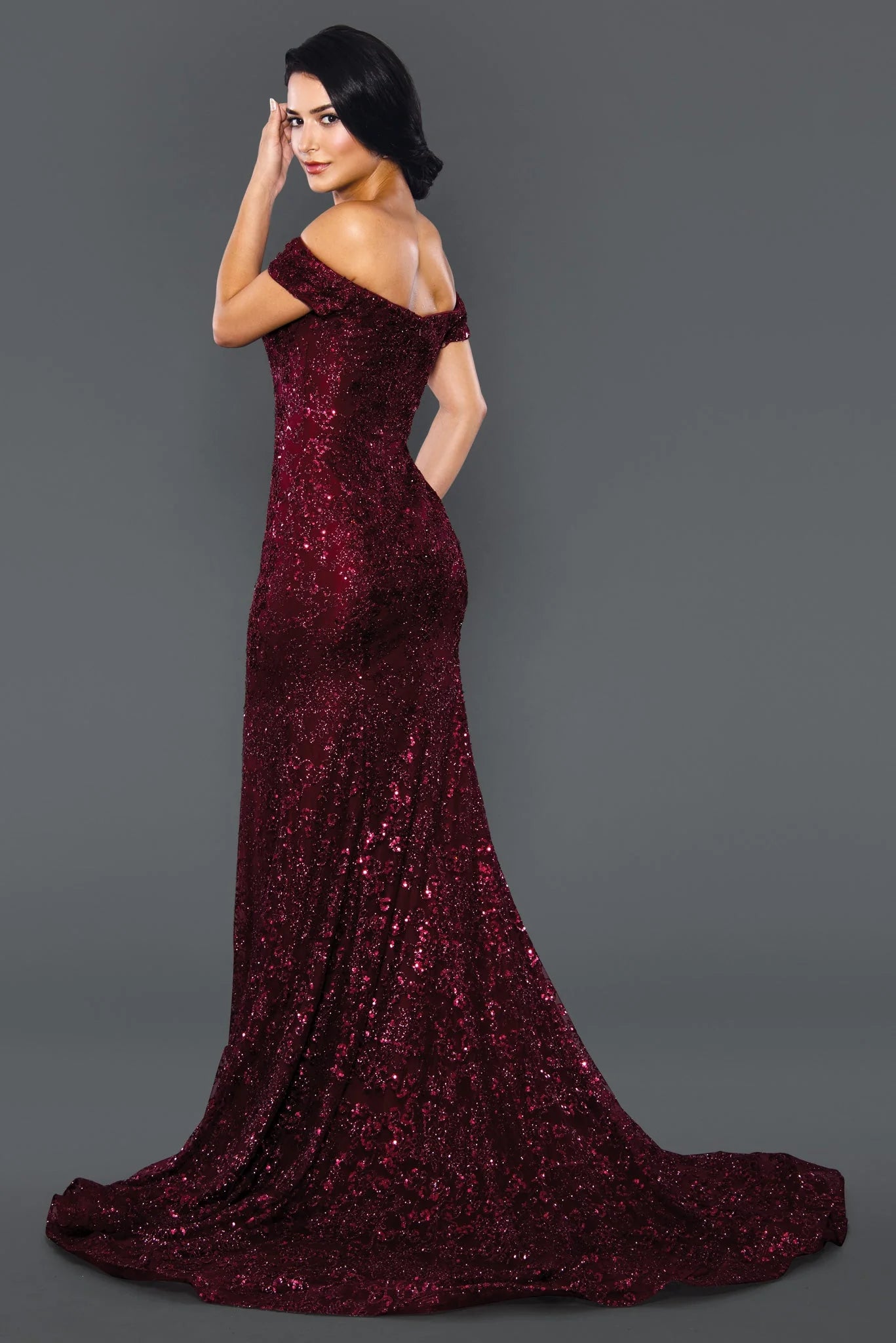 Stella Couture 22069 shimmer Glitter dress offers a stunningly glamorous look for prom. The fitted silhouette and off-the-shoulder design create an elegant, flattering shape, while sparkling glitter fabric adds a touch of glamour. Perfect for making a statement at your prom or special event. 