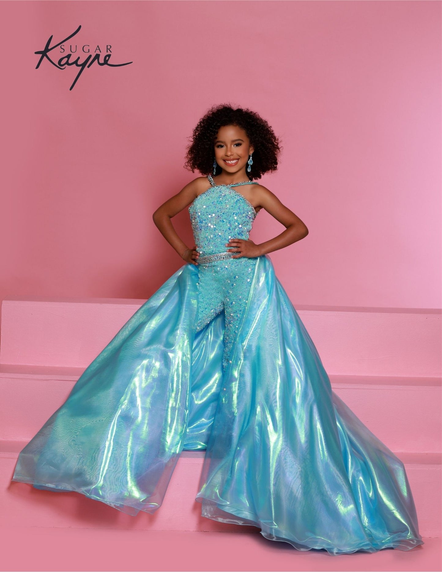 Sugar Kayne C332 offers a unique sequined jumpsuit style for girls and preteens with its fun fashion detachable overskirt and halter neckline on aqua stretch sequin velvet. 