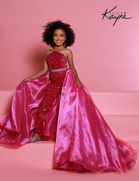 Sugar Kayne C332 offers a unique sequined jumpsuit style for girls and preteens with its fun fashion detachable overskirt and halter neckline on magenta stretch sequin velvet. with overskirt