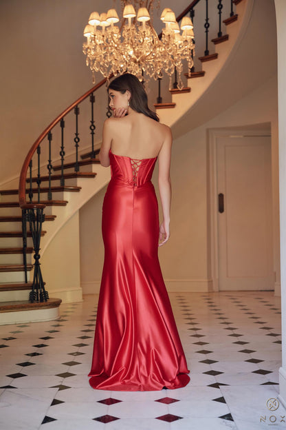 Shine bright at prom in the Nox Anabel T1500 Long Formal Corset Dress. With a cut out bodice and strapless sweetheart neckline, this gown is perfect for a fun and flirty evening. The corset bodice and ruched detailing add a touch of elegance, making you the star of the night.
