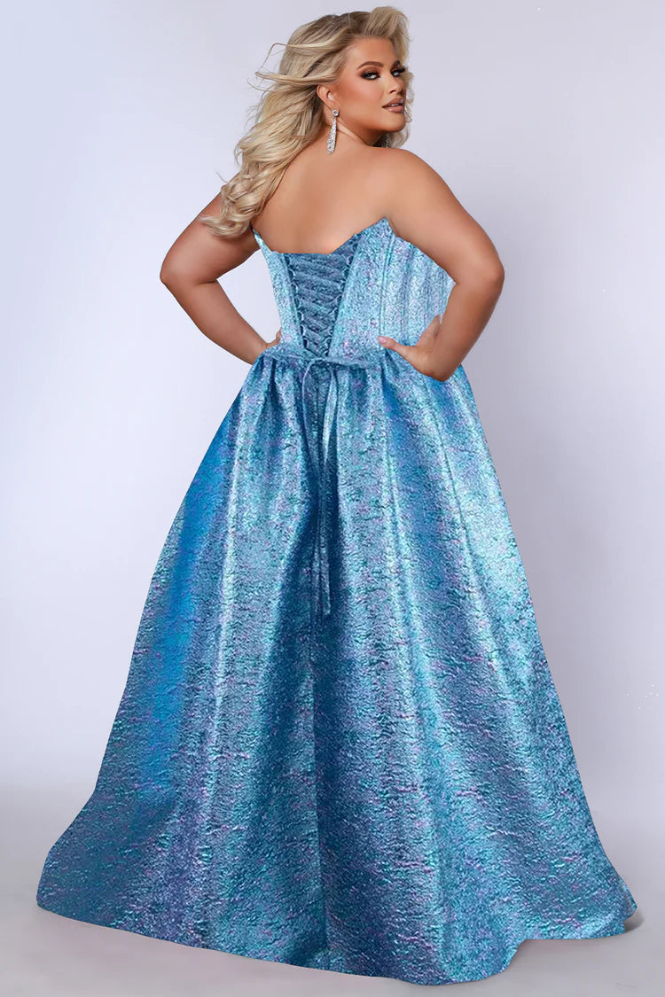 Make a striking entrance in the Sydney's Closet TE2538 Topaz Plus Size Prom Dress. Featuring a daring metallic brocade fabric and a flattering corset bodice, this ballgown effortlessly sculpts your silhouette. The elegant A-line skirt adds movement and drama, ensuring you stand out with confidence and style at prom or any special occasion.

Size: 32

Color: Topaz