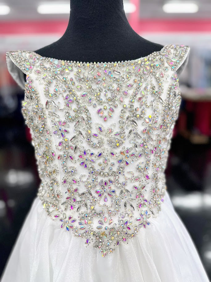 Elevate your little girl's pageant game with the Tiffany Princess 13788 dress. The stunning crystal bodice sparkles underneath the off-shoulder ballgown, making her stand out on stage. The A-line cut flatters any figure, creating a timeless and elegant look for any pageant.

Sizes: 6

Colors: White