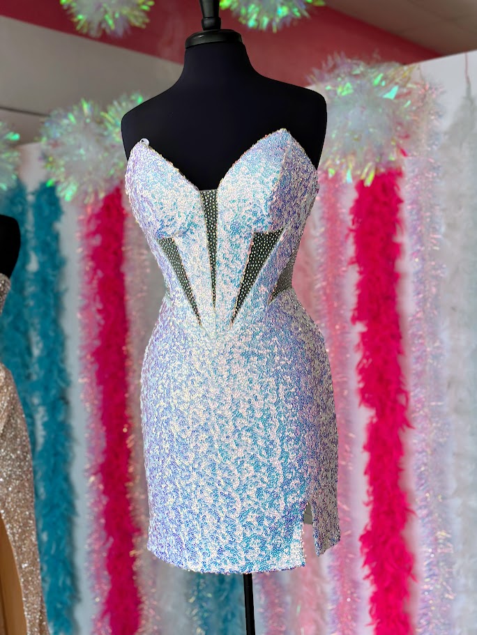 VIENNA Prom&nbsp;60100 Strapless Silhouette Sequin Slit V-Neck Cut Out Bodice Cocktail Homecoming Dress.&nbsp;Feel elegant and glamorous in the Vienna 60100 Strapless Dress. It features a V-neck cut-out bodice adorned with sparkling sequins, a slit design, and a graceful silhouette to flatter any body type. Perfect for any special occasion, this dress is sure to make you stand out in the crowd.

Sizes: 8

Colors: L. Multi (White)