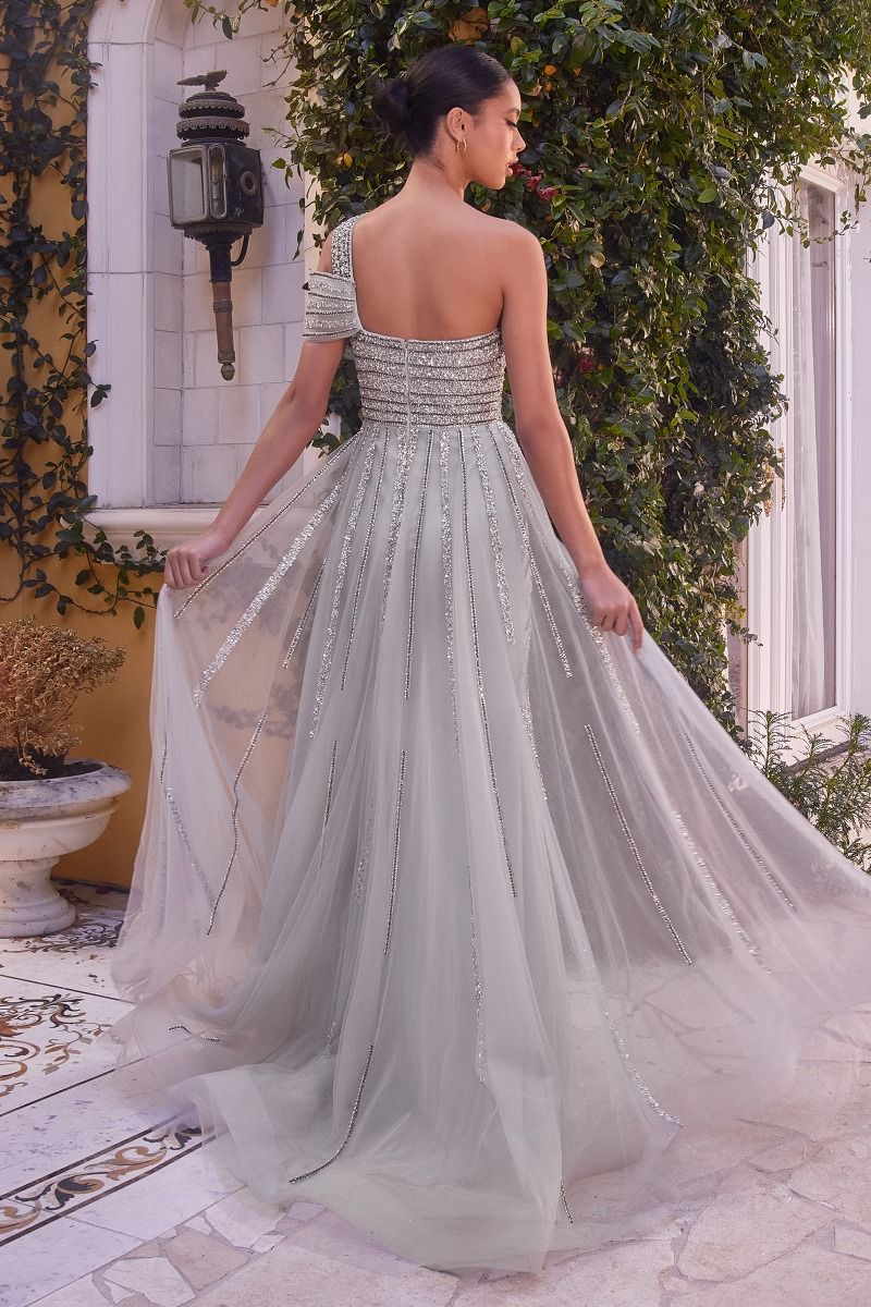 This Andrea & Leo Couture A1314 long dress features intricate sequin beading, an elegant off-the-shoulder neckline, and a stunning overskirt. Perfect for any formal occasion, this dress showcases expert craftsmanship and glamorous design. Stand out in this statement piece and exude confidence and sophistication.