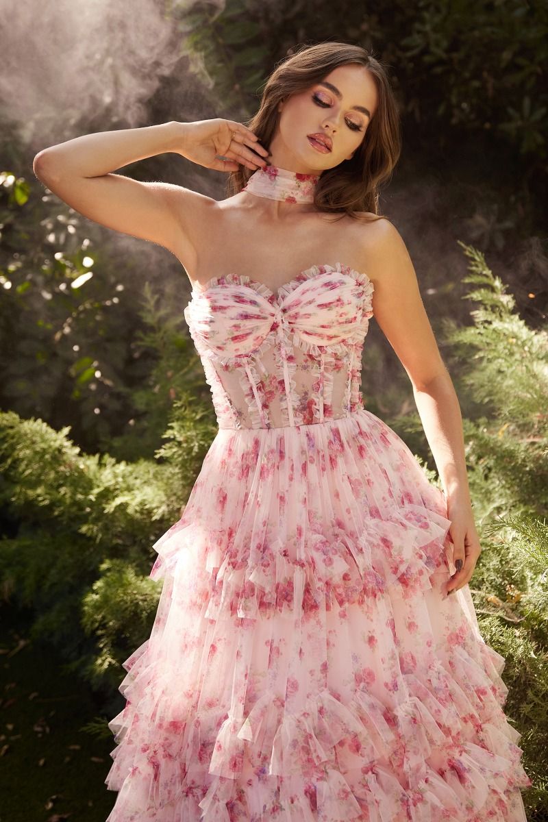 Take center stage in the Andrea & Leo Couture A1334 Floral Pint Pleated Ruffle A Line Prom Dress. The sheer corset and pleated ruffle details add a touch of elegance to this A-line gown. Perfect for formal events, this dress is sure to make you stand out from the crowd. Behold the whimsical allure of this strapless A-line dress! 