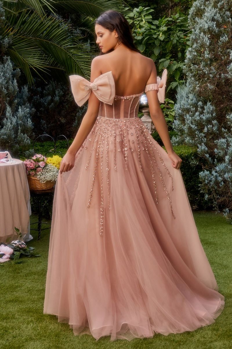 This formal gown by Andrea & Leo Couture, style A1338, features a sheer corset with elegant crystal accents and a flattering A-line silhouette. The bow sleeves add a touch of sophistication to this stunning dress. Perfect for prom or any formal event. Step into a world of romance in our strapless A-line layered tulle gown—a vision of ethereal beauty. The sheer boned bodice, featuring a plunging v-neckline,