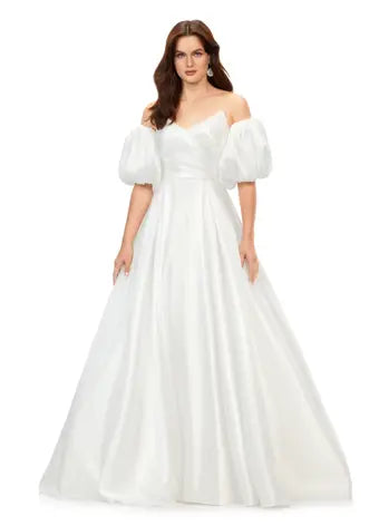 Ashley Lauren 11323 Strapless Detachable Puff Sleeves Phantom Satin Ballgown Dress. This stunning sweetheart ball gown comes with detachable balloon sleeves that give the perfect flare. The back of the gown is adorned with buttons.