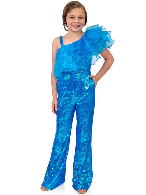 Marc Defang 5026 Girls Sequin One Shoulder Pageant Jumpsuit Ruffle Fun Fashion  Multi layer organza ruffles at neck Fully beaded jumpsuit One side off shoulder design with strap on the other side  Sparkle Iridescent colors  Center Back invisible zipper Knitted inner comfort lining Available Sizes: 4-14  Available Colors: White, Orange, Black, Royal Blue, Fuchsia