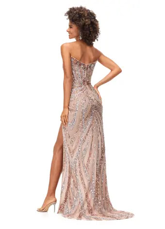 Ashley Lauren 11236 Long Fitted V Neck Slit Beaded Sequin Prom Dress Pageant Gown This strapless gown is sure to turn heads. The sweetheart neckline is complete with a modern floral sequin motif that continues down the bustier and skirt. The skirt is complete with a left leg slit.