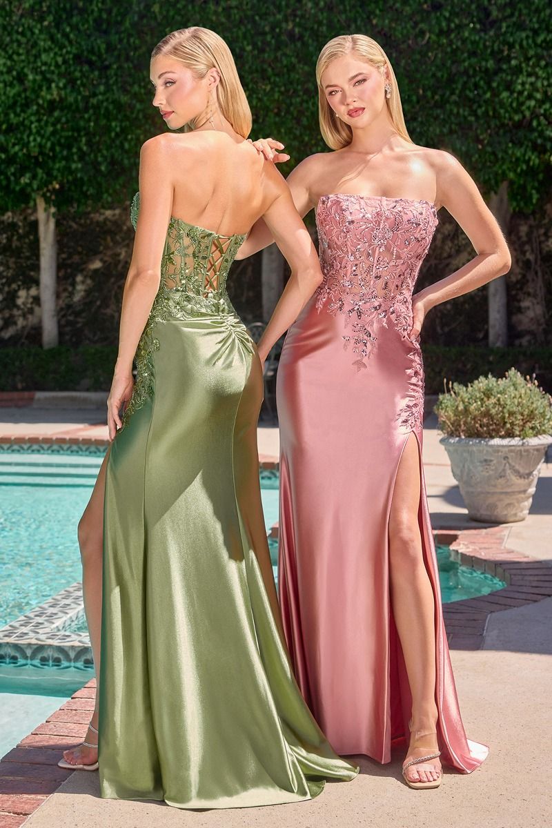 Make a statement in this stunning Ladivine C168 strapless prom dress, designed for those who demand elegance and drama. The structured corset bodice features intricate sequin and bead embellishments that catch the light with every movement, while the sheer detailing adds sophisticated allure. A graceful slit and sweeping train complete the silhouette, ensuring you'll turn heads as you enter the room. Perfect for prom, formal galas, or any black-tie occasion where you want to feel confident and radiant.

Sil