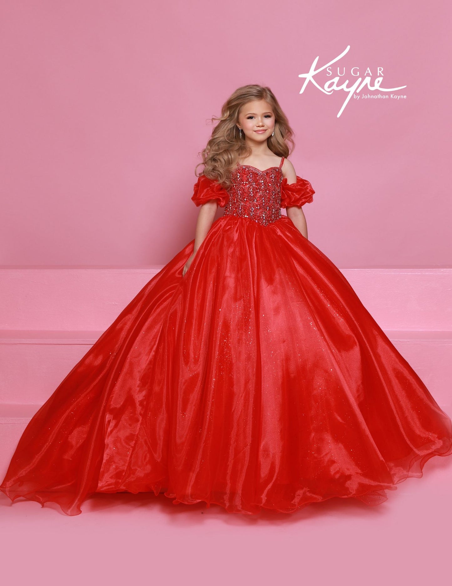 Dazzle on stage with the Sugar Kayne C359 pageant ballgown dress. Featuring a sweetheart neckline, puff sleeves, and spaghetti straps, this dress will make you stand out. With an embellished bodice and a glitter tulle and organza long skirt, you'll sparkle and shine like a true pageant queen.

Colors:&nbsp; Capri Blue, Rose Pink, White, Purple, Red

Sizes:&nbsp; 2-16
