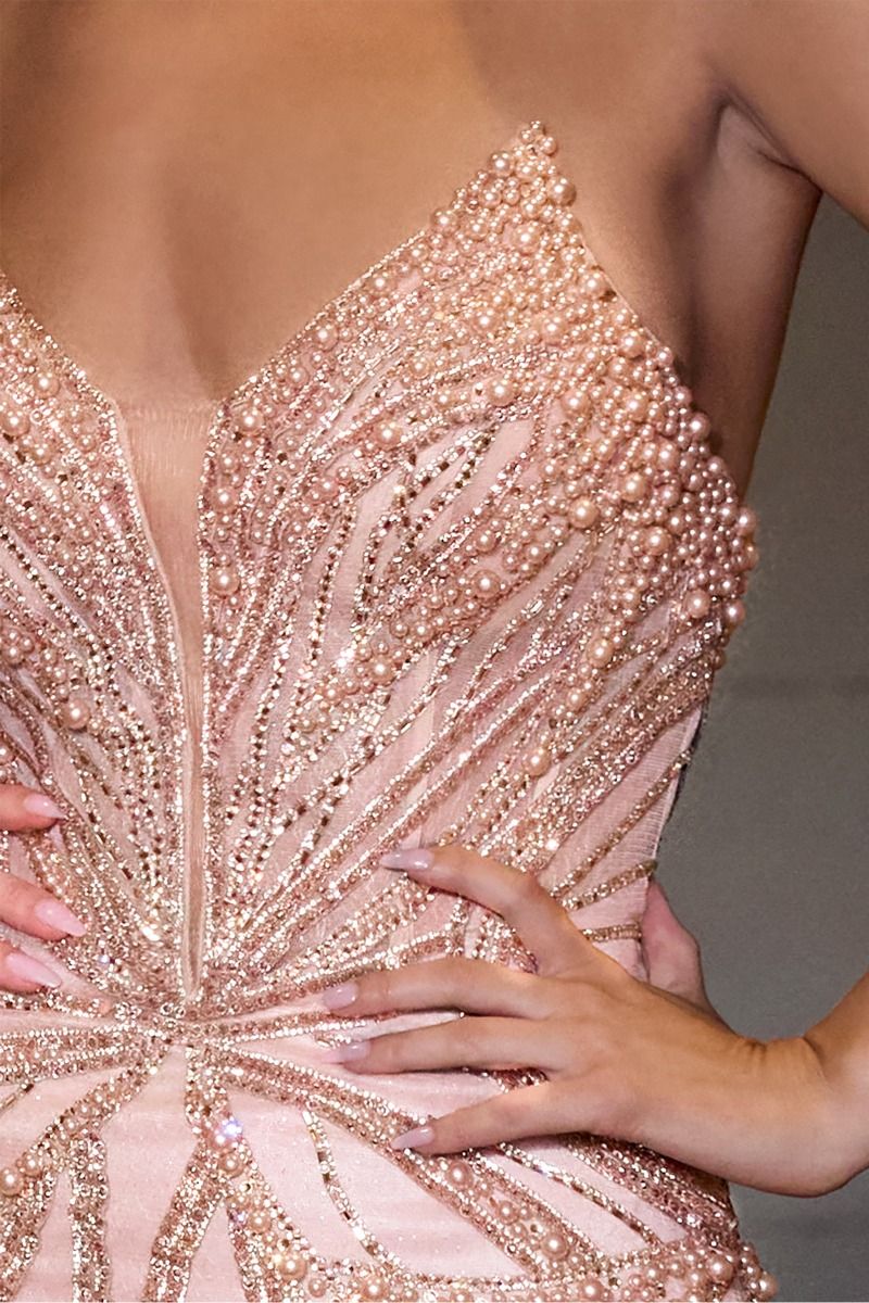 Ladivine CC0688 Strapless Plunging Neckline Prom Dress with Train, Crystals and Pearls Designed for the confident bride or prom attendee, this Ladivine gown features a striking strapless cut with a deep plunging neckline that exudes modern glamour. Hand-placed crystals and pearls embellish the bodice and cascade down the skirt, creating a shimmering focal point. The elegant train extends your silhouette with refined movement and presence. A sophisticated choice for those who prioritize impactful design and 