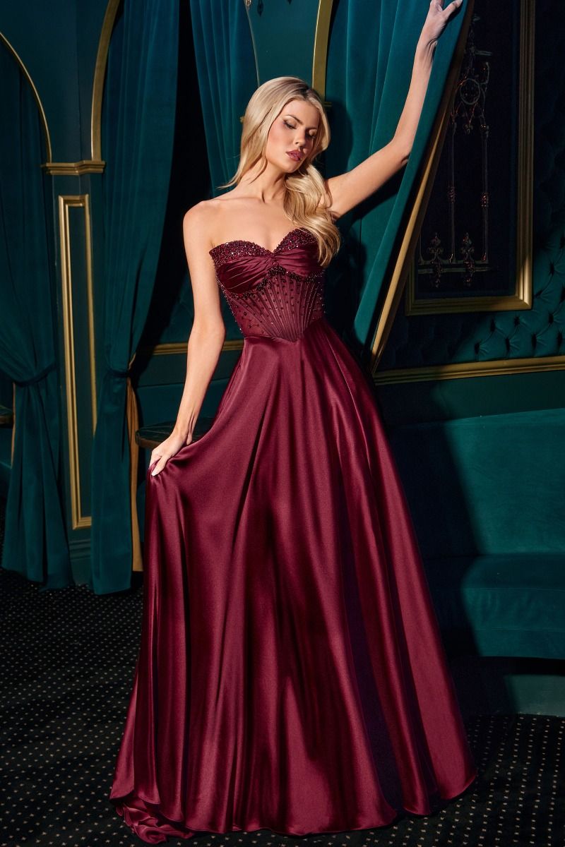 This stunning Ladivine CD297 A-line evening gown combines a strapless sweetheart neckline with removable off-the-shoulder straps for versatile elegance. The intricately beaded bodice features mini floral embellishments, paired with a soft satin skirt that boasts a graceful leg slit. Designed with a structured boned bodice and lace-up corset back, it’s an ideal choice for prom or any formal event where refined beauty is key.