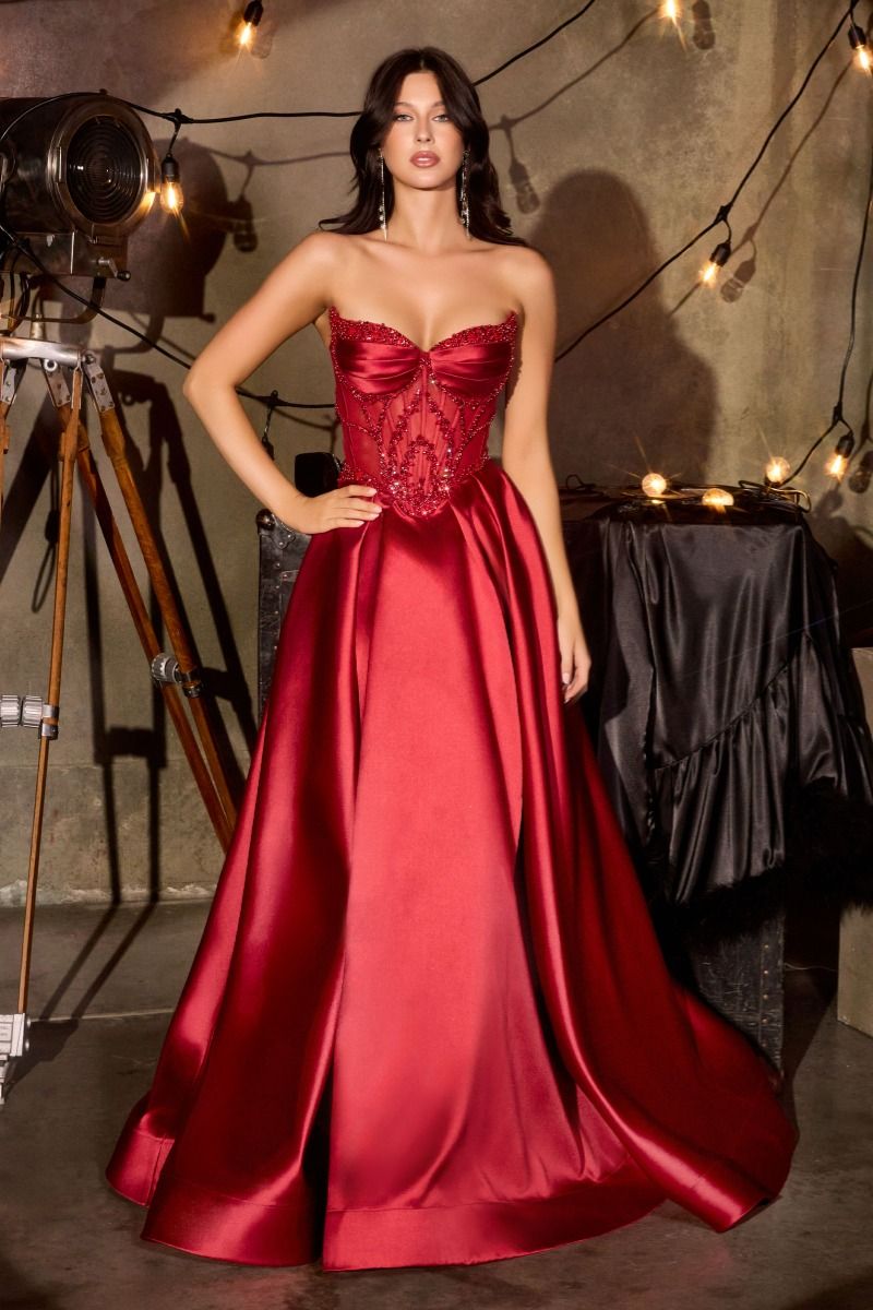 Ladivine CD389 Beaded Sheer Corset Prom Dress Formal Gown This stunning A-line formal gown features an intricately beaded sheer corset bodice with a sweetheart neckline that commands attention. Structured pleated cups provide elegant support and definition, while the flowing skirt offers graceful movement. Functional side pockets add practical sophistication—a rare luxury in formal wear. The delicate beadwork catches light beautifully, creating an editorial-worthy silhouette perfect for prom, galas, or blac