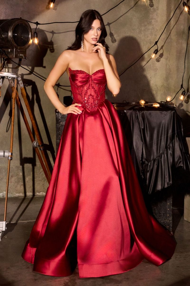 Ladivine CD389 Beaded Sheer Corset Prom Dress Formal Gown This stunning A-line formal gown features an intricately beaded sheer corset bodice with a sweetheart neckline that commands attention. Structured pleated cups provide elegant support and definition, while the flowing skirt offers graceful movement. Functional side pockets add practical sophistication—a rare luxury in formal wear. The delicate beadwork catches light beautifully, creating an editorial-worthy silhouette perfect for prom, galas, or blac