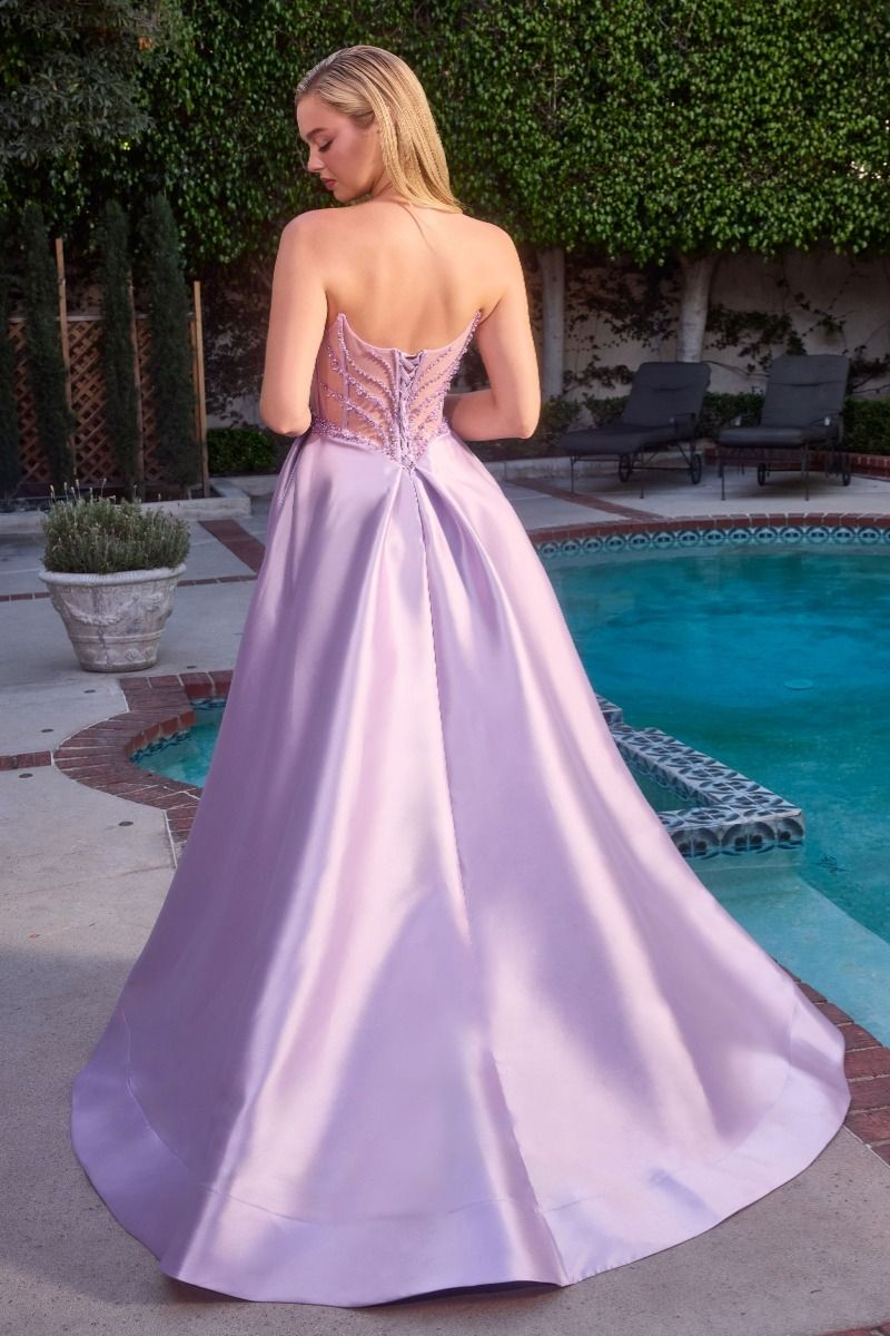 Ladivine CD389 Beaded Sheer Corset Prom Dress Formal Gown This stunning A-line formal gown features an intricately beaded sheer corset bodice with a sweetheart neckline that commands attention. Structured pleated cups provide elegant support and definition, while the flowing skirt offers graceful movement. Functional side pockets add practical sophistication—a rare luxury in formal wear. The delicate beadwork catches light beautifully, creating an editorial-worthy silhouette perfect for prom, galas, or blac