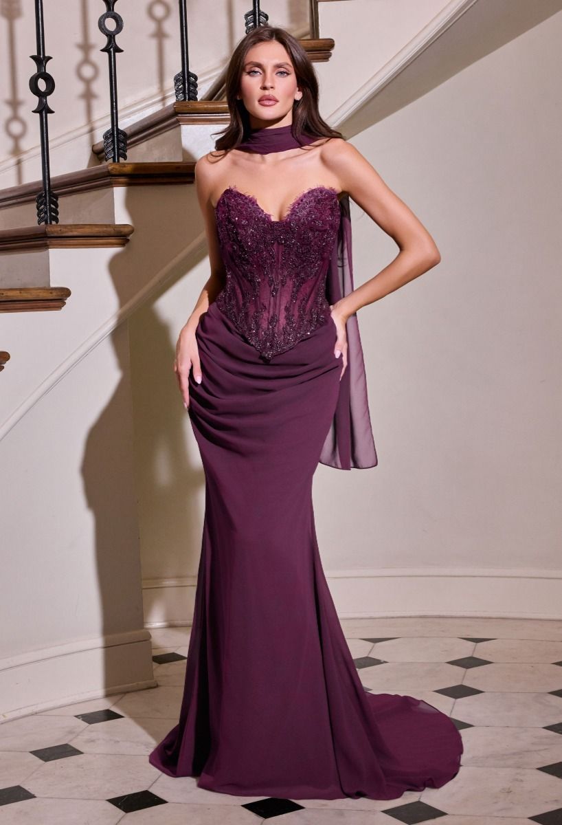 Elevate your prom night with the Ladivine CD683, a strapless masterpiece that commands attention. This sophisticated gown features intricate beading across a sheer corset bodice, creating an alluring silhouette with architectural precision. The lace-up back detail adds dramatic flair while allowing for a customized fit, and the flowing train ensures a grand entrance. Crafted for those who appreciate couture-quality construction and timeless elegance, this dress transforms the traditional prom experience int