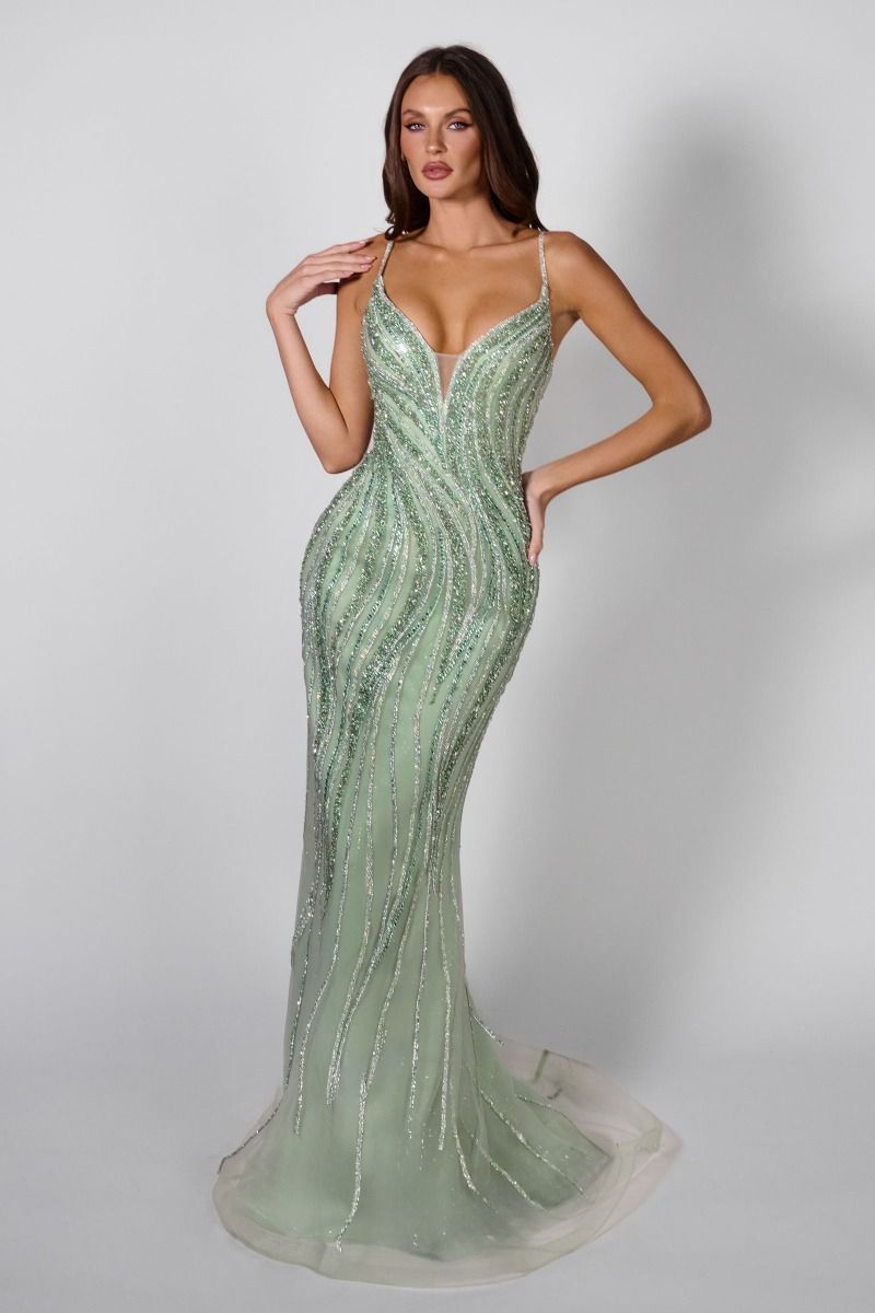 Make an unforgettable entrance in the Ladivine CD719, a stunning beaded prom dress designed for pageant-worthy moments. This elegant gown features a plunging V-neckline, delicate spaghetti straps, and intricate beadwork that catches the light beautifully. The matching choker adds a sophisticated touch, while the graceful train creates dramatic movement as you walk. Perfect for prom, pageants, or any formal occasion where you want to command attention with timeless glamour and refined style.

Silhouette:&nbs