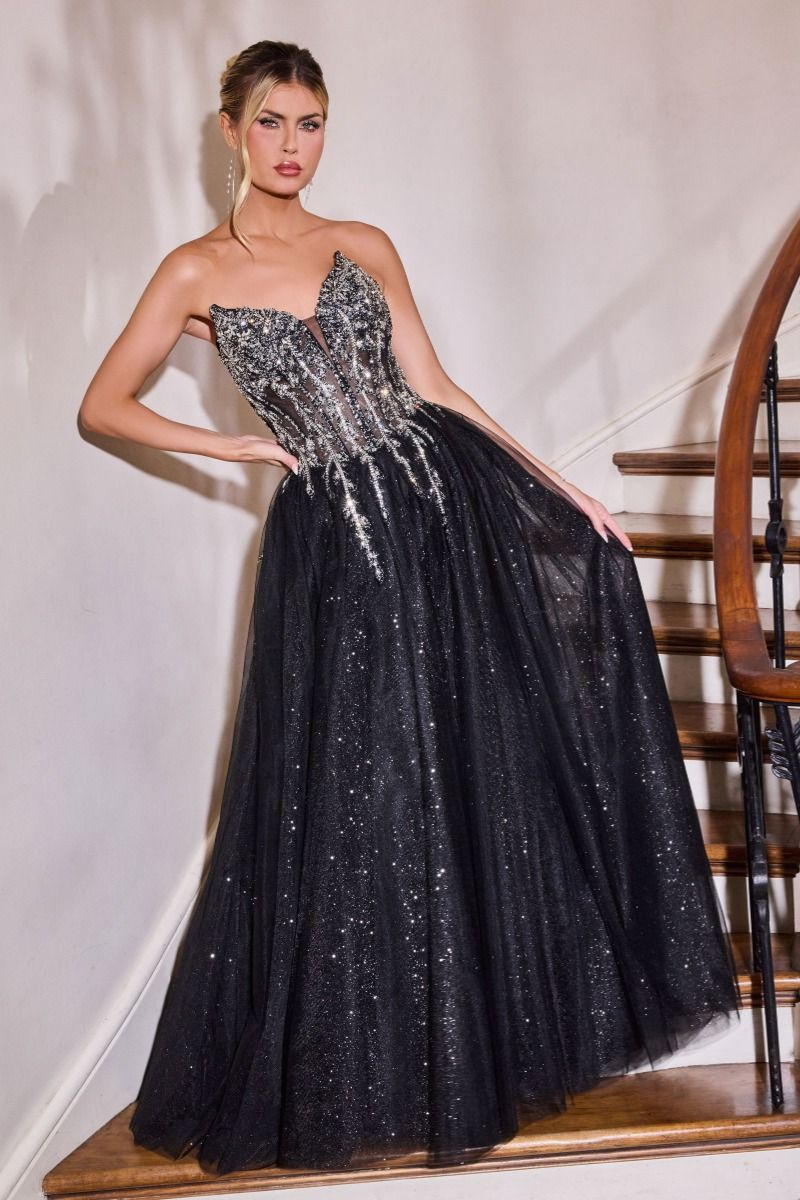 Elevate your prom night with the Ladivine CD721, a strapless A-line gown that commands attention. The plunging sweetheart neckline frames your silhouette beautifully, while intricate crystal embellishments adorn the corset bodice for a touch of glamour. The flowing skirt creates an elegant silhouette that moves gracefully across the dance floor, and the dramatic train adds a finishing flourish of sophistication. Perfect for those seeking a show-stopping formal look that balances modern edge with timeless el