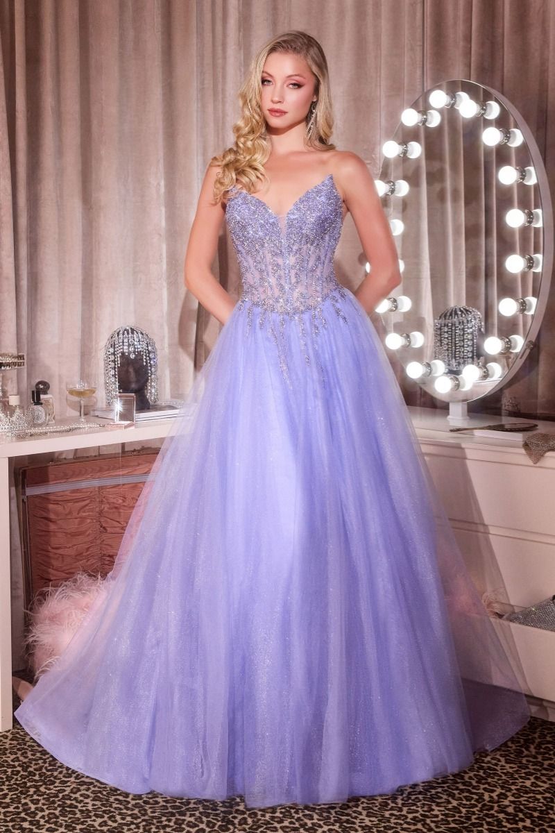 Elevate your prom night with the Ladivine CD721, a strapless A-line gown that commands attention. The plunging sweetheart neckline frames your silhouette beautifully, while intricate crystal embellishments adorn the corset bodice for a touch of glamour. The flowing skirt creates an elegant silhouette that moves gracefully across the dance floor, and the dramatic train adds a finishing flourish of sophistication. Perfect for those seeking a show-stopping formal look that balances modern edge with timeless el