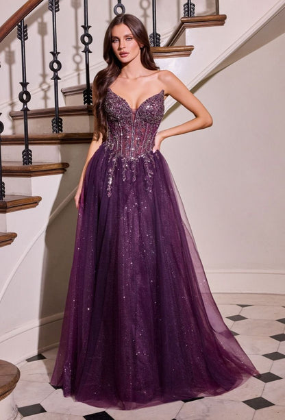 Elevate your prom night with the Ladivine CD721, a strapless A-line gown that commands attention. The plunging sweetheart neckline frames your silhouette beautifully, while intricate crystal embellishments adorn the corset bodice for a touch of glamour. The flowing skirt creates an elegant silhouette that moves gracefully across the dance floor, and the dramatic train adds a finishing flourish of sophistication. Perfect for those seeking a show-stopping formal look that balances modern edge with timeless el