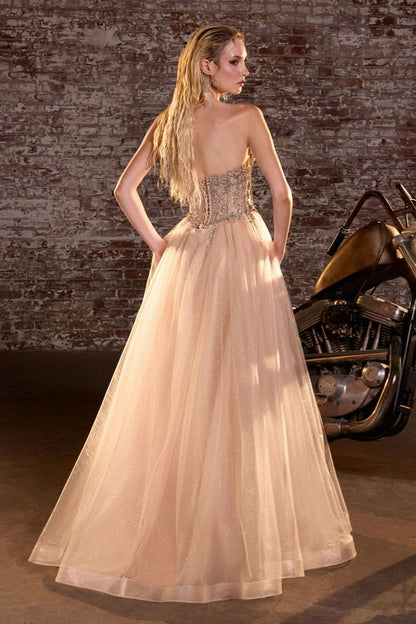Elevate your prom night with the Ladivine CD721, a strapless A-line gown that commands attention. The plunging sweetheart neckline frames your silhouette beautifully, while intricate crystal embellishments adorn the corset bodice for a touch of glamour. The flowing skirt creates an elegant silhouette that moves gracefully across the dance floor, and the dramatic train adds a finishing flourish of sophistication. Perfect for those seeking a show-stopping formal look that balances modern edge with timeless el