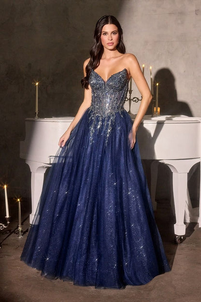 Elevate your prom night with the Ladivine CD721, a strapless A-line gown that commands attention. The plunging sweetheart neckline frames your silhouette beautifully, while intricate crystal embellishments adorn the corset bodice for a touch of glamour. The flowing skirt creates an elegant silhouette that moves gracefully across the dance floor, and the dramatic train adds a finishing flourish of sophistication. Perfect for those seeking a show-stopping formal look that balances modern edge with timeless el
