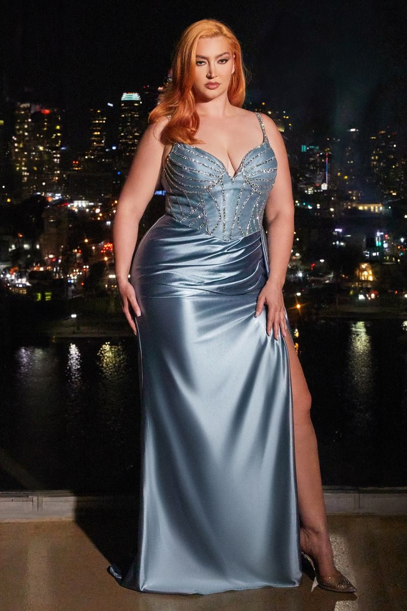 Be the belle of the ball in the Ladivine CDS440 Prom Dress. This stunning gown features a sheer crystal corset, adding a touch of glamour to your look. The satin fabric and overskirt add elegance, while the plus size fit ensures a flattering silhouette. Perfect for any special occasion. 
