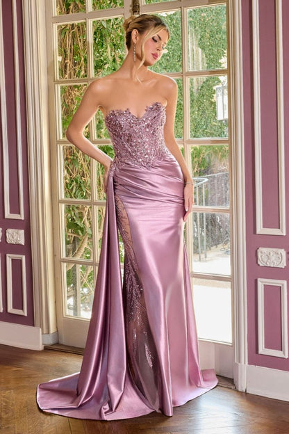 Elevate your prom night with the Ladivine CDS565, a stunning strapless gown designed to captivate. This exquisite dress features a sweetheart neckline and a sheer beaded corset bodice that creates an alluring silhouette. The intricate beadwork catches light beautifully, while the graceful train adds dramatic elegance as you move. Perfect for those seeking a show-stopping formal look that balances sophistication with glamour.

Silhouette:&nbsp;Fitted
Design:&nbsp;Sweetheart neckline, fully beaded bodice &amp