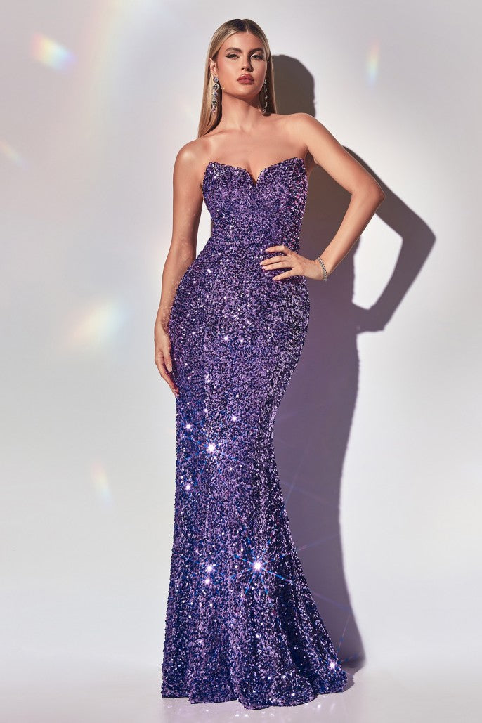 Look and feel glamorous in Ladivine's CH151 Long Strapless Velvet Sequin Mermaid Evening Gown. Designed with a strapless and form-fitting silhouette and featuring a peak point v-neckline and a custom lace up back, this stunning dress is crafted from sequins to give an elegant look that's perfect for a formal event.  Sizes: XS-3X (see size chart in Images)  Colors: Black, Emerald, Fuchsia, Lavender, Ocean Blue, Red, Royal