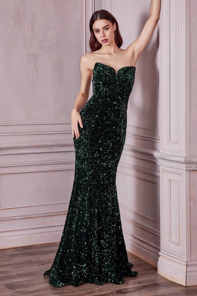 Look and feel glamorous in Ladivine's CH151 Long Strapless Velvet Sequin Mermaid Evening Gown. Designed with a strapless and form-fitting silhouette and featuring a peak point v-neckline and a custom lace up back, this stunning dress is crafted from sequins to give an elegant look that's perfect for a formal event.  Sizes: XS-3X (see size chart in Images)  Colors: Black, Emerald, Fuchsia, Lavender, Ocean Blue, Red, Royal