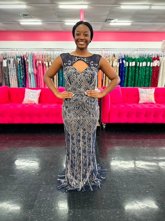 Envious Couture E1206 is a long fitted hand beaded lace formal evening gown. Featuring a sheer illusion high neckline. Great for any formal event!

Available in Navy size 12