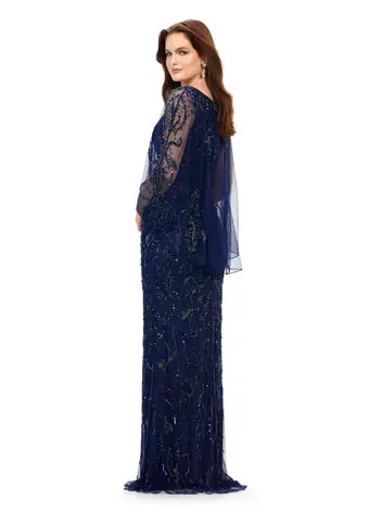 Ashley Lauren 11214 Fully Hand Beaded Crew Neckline High Back Overlay Fitted Evening Dress. A timeless evening gown complete with a sheer overlay. This gown has a sequin motif that sparkles throughout the gown and overlay. Talk about elegant!