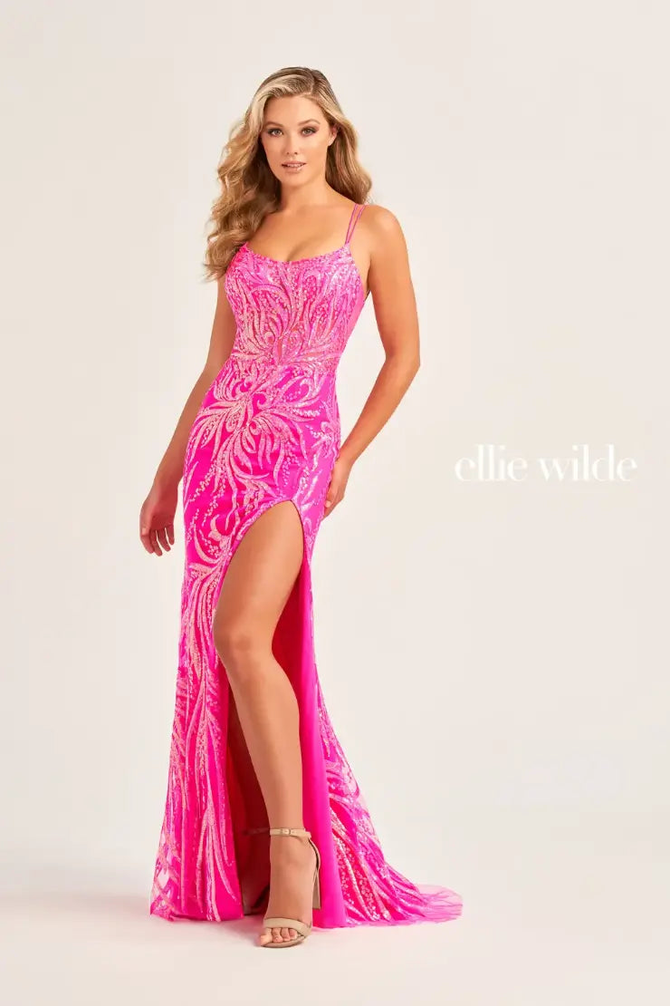 Make a statement in this Ellie Wilde EW35046 prom dress. Featuring a sheer sequin design, slit, scoop neck, backless corset, and formal gown style. With its elegant and unique features, this dress is perfect for any formal occasion. Shine and stand out in this stunning dress.  Sizes: 00-16  Colors: MAGENTA, ULTRA VIOLET, CERULEAN BLUE