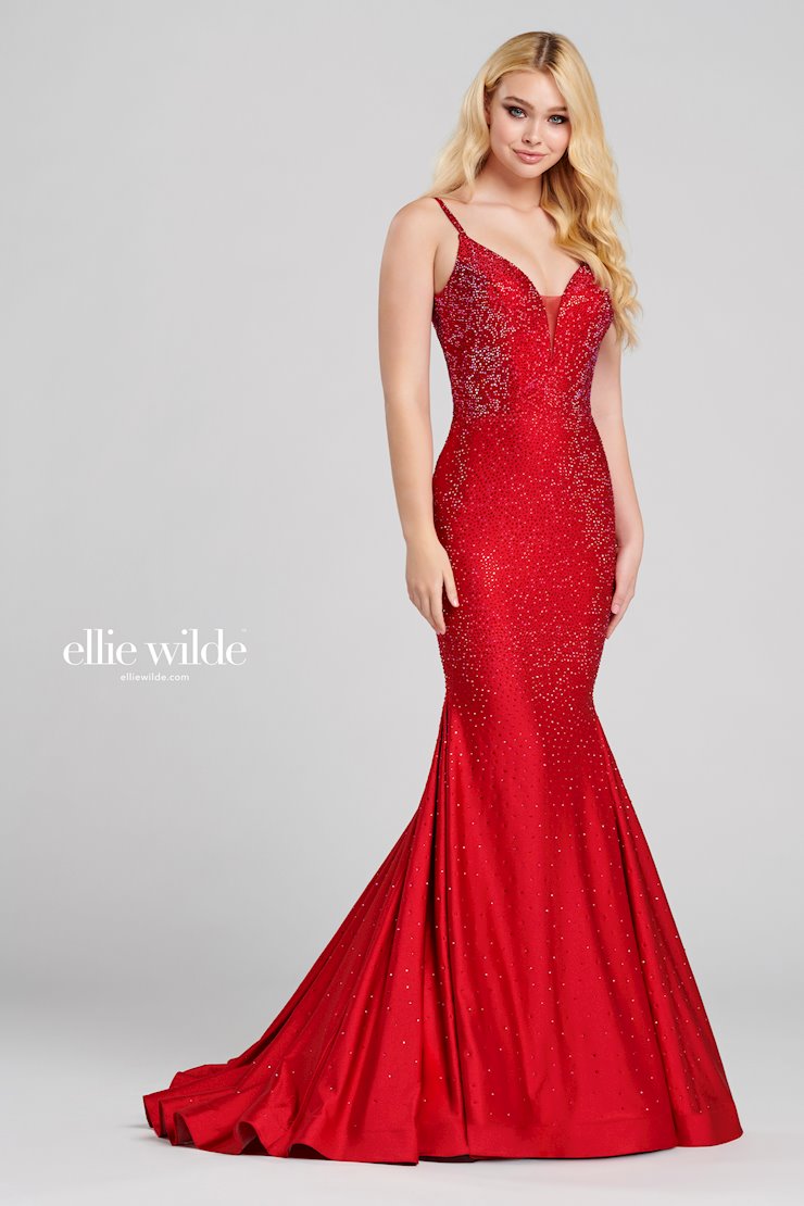 Look stunning in this Ellie Wilde EW120012 prom dress. This gorgeous mermaid-style gown has a backless crystal jersey design and sparkling crystal appliqué detailing that will make you shine on the dance floor. The fitted jersey fabric ensures that you’ll look your best in this dazzling gown. Sleeveless novelty stretch fit and flare gown with a plunging V-neck, natural waist, stone accents throughout gown, open bandeau back, horsehair hem and a sweep train.