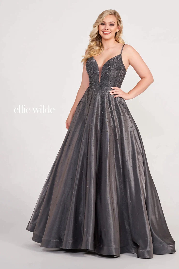 Make a statement at your next formal event in the stunning Ellie Wilde EW121005 Crystal Covered Shimmer Satin Ballgown Corset Prom Dress V Neck. This sleeveless dress is designed with a novelty stretch jersey and stone accent ball gown, featuring a plunging V-neck, natural waist, lace up back, and a horsehair hem. Plus, two convenient pockets make it easy to keep essentials close by. Complete with a sweep train, this dress will ensure you look your best.