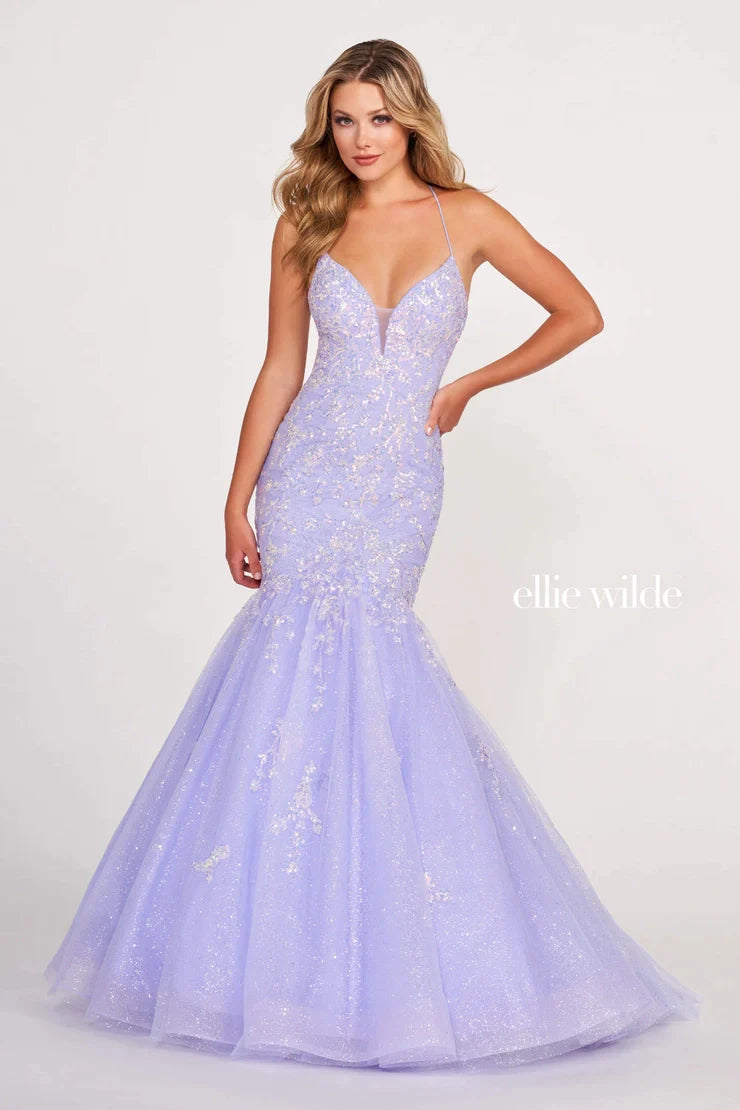 Exude glamour on your special night in the EW34011 Ellie Wilde Sequin Backless Corset Mermaid Prom Dress. This luxurious dress features an intricate sequin bodice, corset back closure, and shimmer formal trumpet skirt. The plunging V neckline is sure to have all eyes on you as you make your grand entrance.  Sizes: 00-16  Colors: ORANGE, PERIWINKLE, EMERALD, HOT PINK