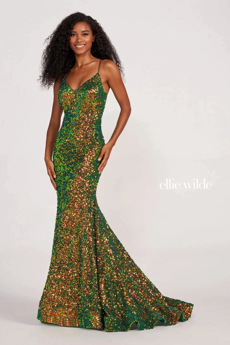 Look sophisticated and graceful in Ellie Wilde EW34016. The signature Iridescent color shifting sequins and mermaid silhouette make this timeless corset dress a perfect choice for a formal occasion. Captivate everyone in the room with its sparkling iridescent material and backless v-neckline.  Sizes: 00-20  Colors: ORANGE, LIGHT BLUE, HOT PINK, IRIS, FOREST LIGHT, PURPLE RAIN  https://dy9ihb9itgy3g.cloudfront.net/static/themes/EllieWilde/Spring_2023/EW34016.mp4