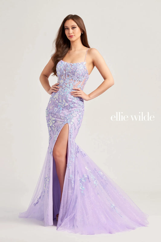 Elevate your prom look with the Ellie Wilde EW35057 dress. The sheer sequin lace corset adds a touch of elegance and the mermaid silhouette enhances your figure. With a daring slit and backless design, this dress is sure to make a statement. A scoop neck completes the look.   Sizes: 00-16  Colors: Lilac, Ice Blue