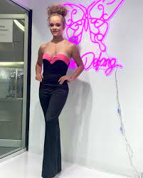 This Marc Defang 8171 Strapless Pageant Jumpsuit Satin Sweetheart Formal offers a sophisticated look and feel. Its black and pink coloring, strapless design and satin sweetheart bodice are perfect for any special occasion. Featuring a fitted waistband and full-length legs, this elegant jumpsuit will flatter and fit any body type.  Sizes: 00-16  Colors: Yellow/Royal Blue, Hot Pink/Black, Hot Pink