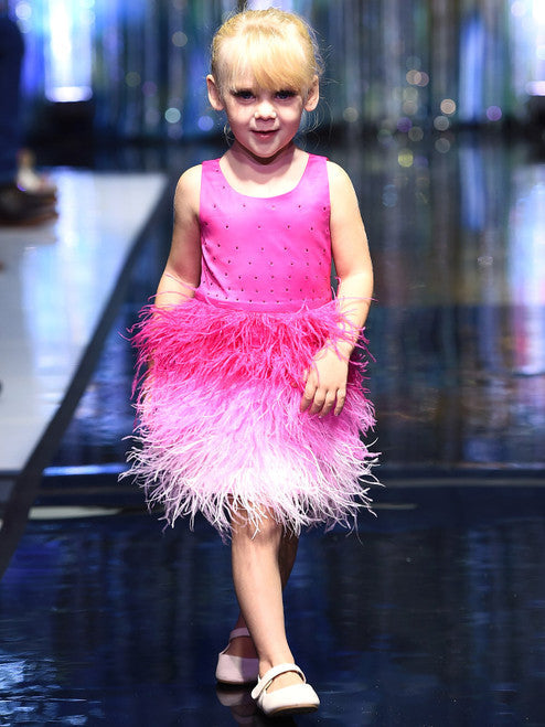 A must-have for the fashion-savvy young girl, this Marc Defang 5118 Girls Short Feather Ombre Pageant Dress features a unique, hand sewn ostrich feather all-over skirt with an ombre pattern and a beaded waistline. Embellished with hand-placed crystals along the top, this dress is fully lined and features a center back invisible zipper for a comfortable fit.  Sizes: 4,5,6,7,8,9,10,11,12,13,14  Colors: Pink, Hot Pink  *Choose Custom color from swatches! allow 25-30 days delivery